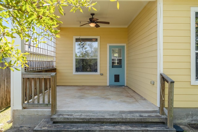 doorway to property featuring a ceiling fan and a patio