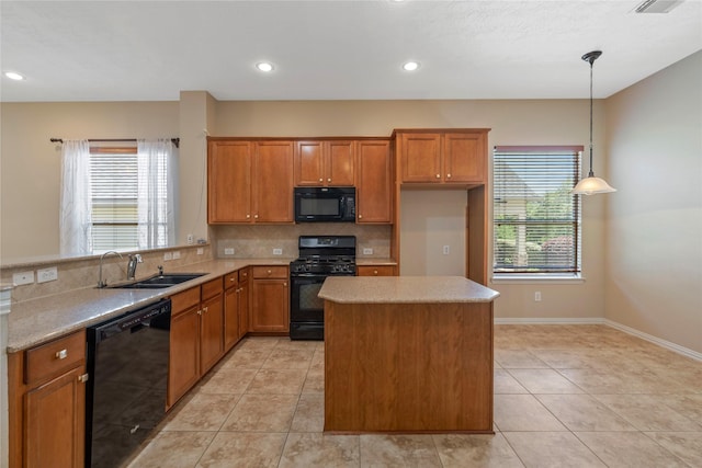kitchen with brown cabinets, a sink, black appliances, and light tile patterned floors
