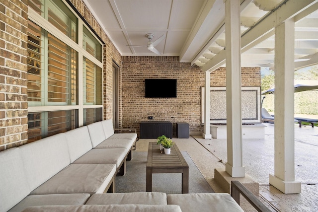 view of patio / terrace with an outdoor living space and a ceiling fan