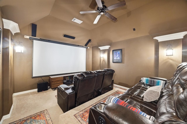 carpeted home theater with visible vents, ceiling fan, baseboards, and lofted ceiling