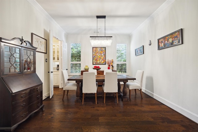 dining area featuring an inviting chandelier, baseboards, ornamental molding, and wood finished floors