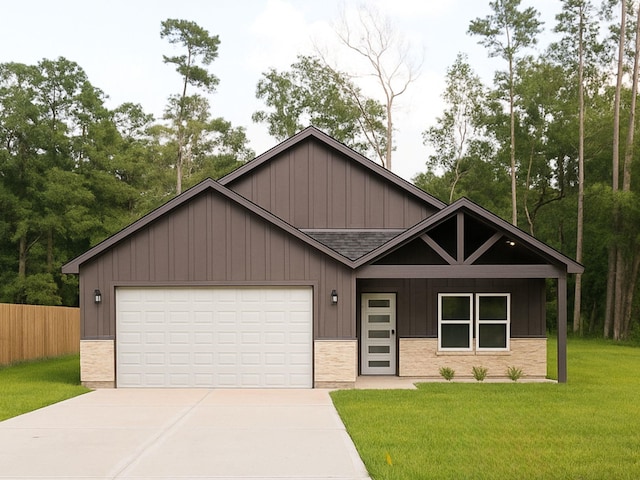 15016 Indian Hill Trl, Willis, TX 77378 - view of front facade with board and batten siding, roof with shingles, concrete driveway, and an attached garage