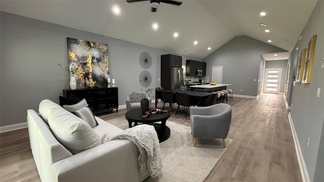 15016 Indian Hill Trl, Willis, TX 77378 - living area featuring ceiling fan, light wood-style flooring, recessed lighting, and high vaulted ceiling