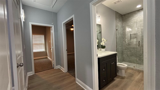 15016 Indian Hill Trl, Willis, TX 77378 - full bathroom with wood finished floors, vanity, and a stall shower