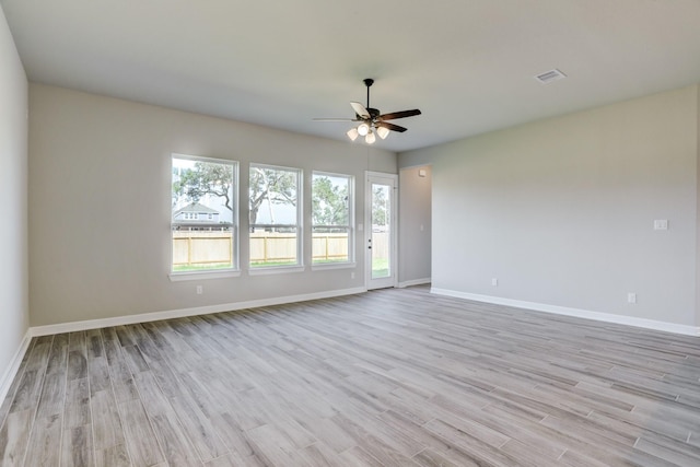 1613 Mija Park Rd, Seabrook, TX 77586 - spare room with light wood-style floors, baseboards, a ceiling fan, and visible vents