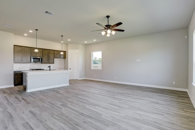 1613 Mija Park Rd, Seabrook, TX 77586 - unfurnished living room featuring light wood finished floors, a ceiling fan, visible vents, and recessed lighting