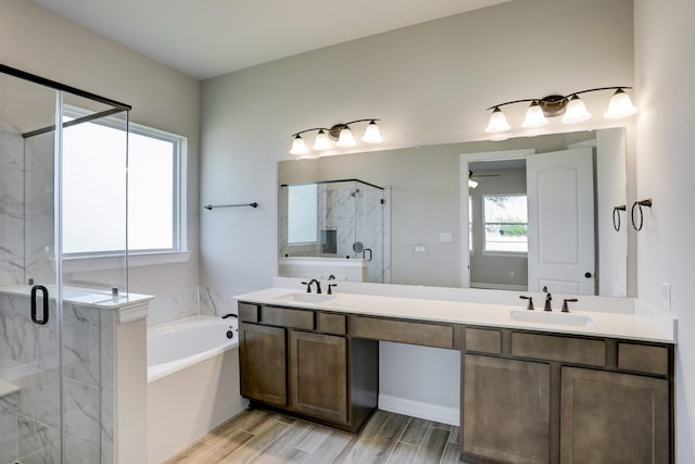 1613 Mija Park Rd, Seabrook, TX 77586 - full bathroom featuring a bath, a stall shower, a sink, and a ceiling fan