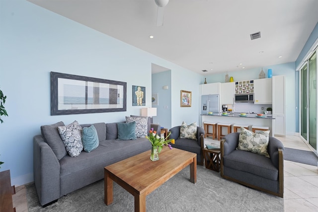 living area with recessed lighting, visible vents, a ceiling fan, and light tile patterned floors