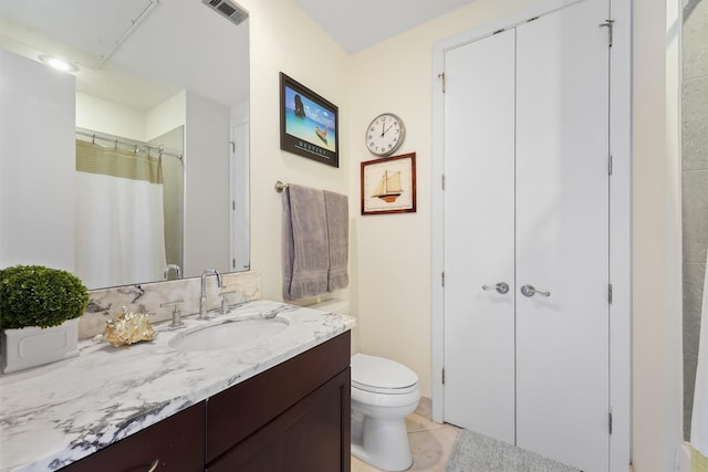 bathroom with a shower with curtain, toilet, visible vents, tile patterned flooring, and vanity