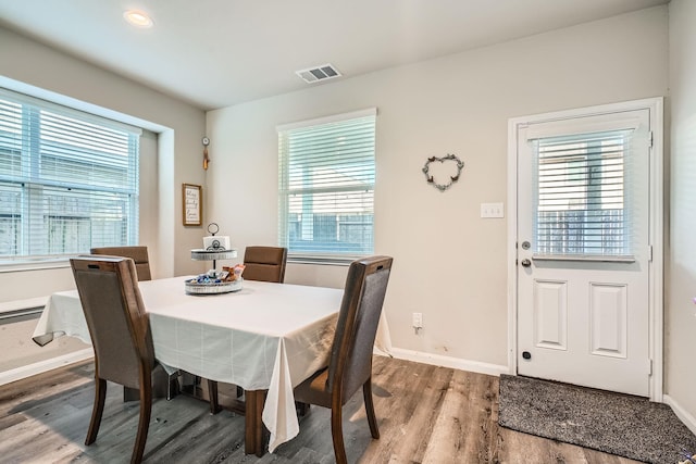 25639 Brooklyn Ln, Porter, TX 77365 - dining area with wood finished floors, baseboards, visible vents, and plenty of natural light