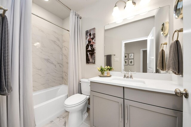 bathroom featuring vanity, shower / tub combo with curtain, toilet, and marble finish floor