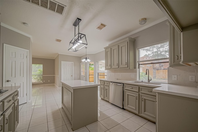 215 Wood Circle Ln, Houston, TX 77015 - kitchen with stainless steel dishwasher, a kitchen island, ornamental molding, light countertops, and light tile patterned flooring