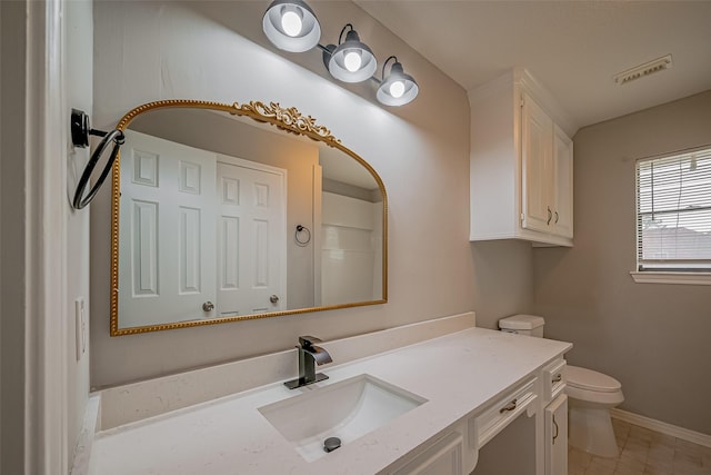215 Wood Circle Ln, Houston, TX 77015 - bathroom featuring vanity, toilet, and baseboards