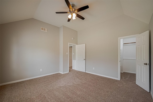 215 Wood Circle Ln, Houston, TX 77015 - unfurnished bedroom with a walk in closet, carpet, ceiling fan, baseboards, and high vaulted ceiling