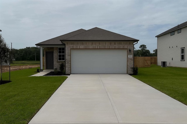 25984 Liberation Rd, Cleveland, TX 77328 - view of front of house with brick siding, driveway, and an attached garage