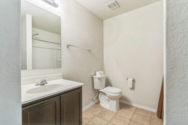 315 Prato Brezza, San Antonio, TX 78253 - bathroom featuring vanity, toilet, tile patterned floors, baseboards, and a shower