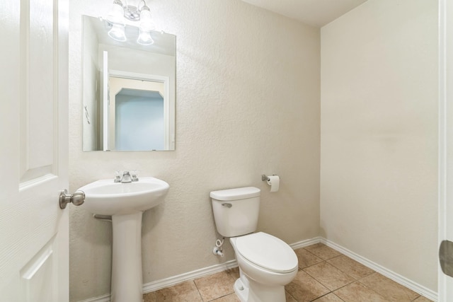 315 Prato Brezza, San Antonio, TX 78253 - bathroom with toilet, tile patterned flooring, a sink, and baseboards