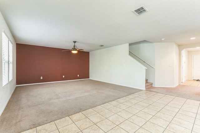 315 Prato Brezza, San Antonio, TX 78253 - unfurnished living room with light carpet, ceiling fan, stairway, baseboards, and recessed lighting