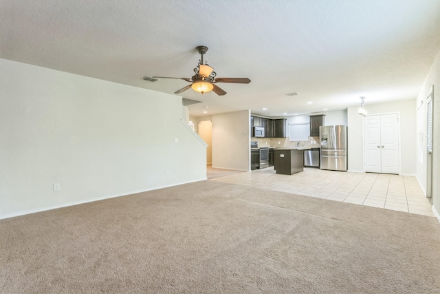 315 Prato Brezza, San Antonio, TX 78253 - unfurnished living room with light carpet, baseboards, light tile patterned floors, ceiling fan, and recessed lighting
