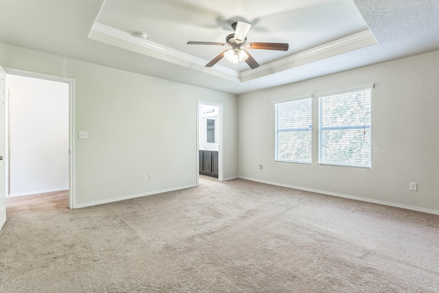 315 Prato Brezza, San Antonio, TX 78253 - unfurnished room featuring a raised ceiling, ornamental molding, ceiling fan, light carpet, and baseboards