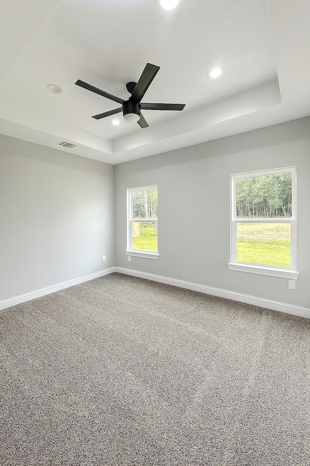25759 Hickory Ln, Splendora, TX 77372 - unfurnished room featuring a ceiling fan, recessed lighting, carpet floors, and a tray ceiling