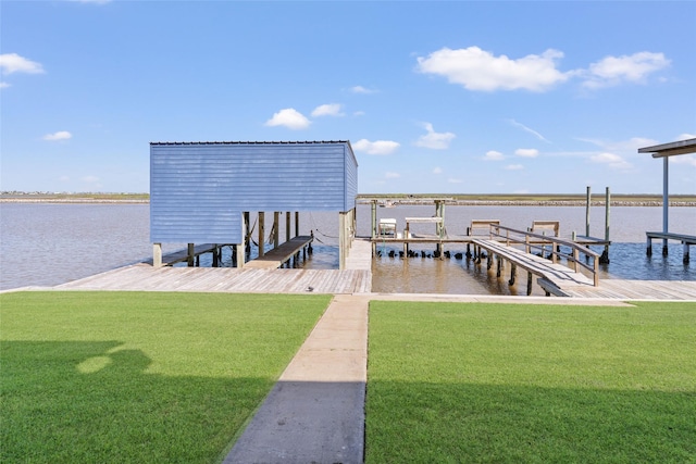 view of dock featuring boat lift, a yard, and a water view