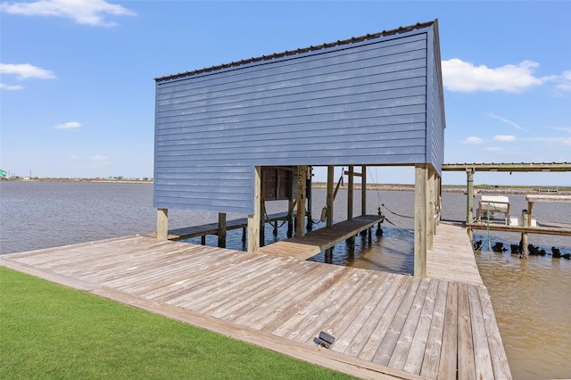 view of dock featuring a water view and boat lift