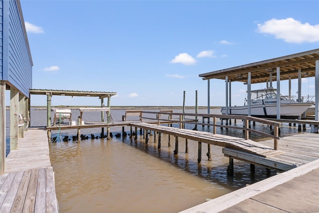 view of dock featuring a water view and boat lift
