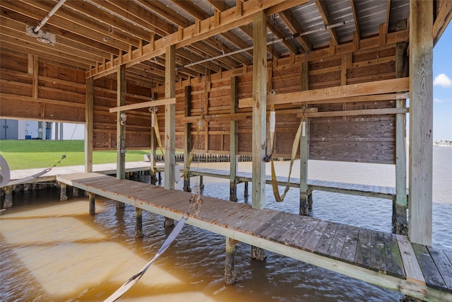 view of dock featuring boat lift and a water view