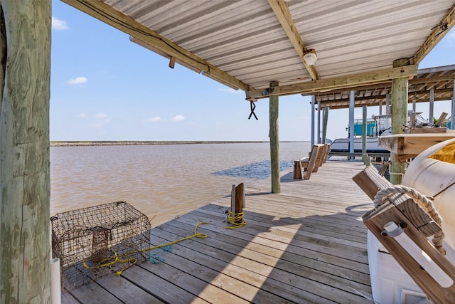 view of dock featuring a water view and boat lift