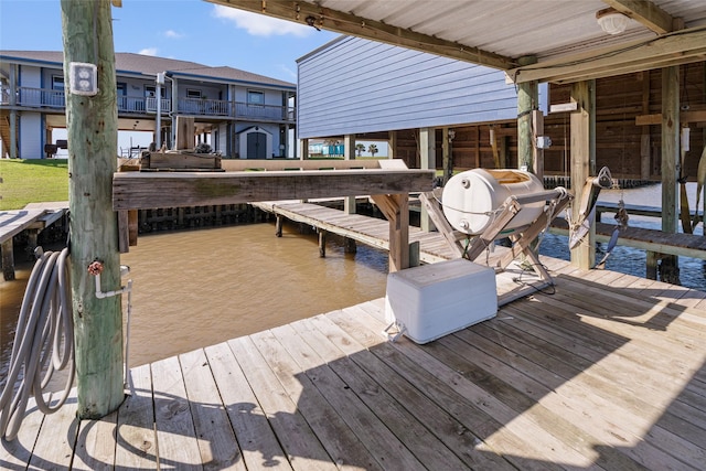view of dock featuring a water view and boat lift