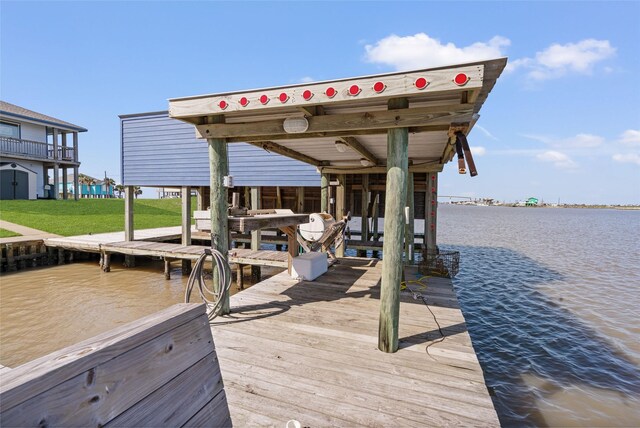 view of dock featuring boat lift and a water view