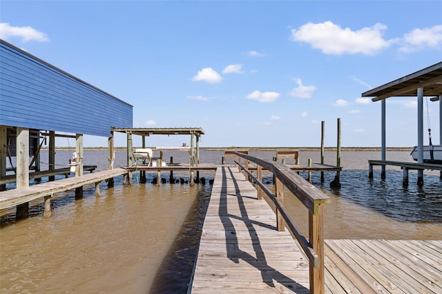 view of dock with a water view and boat lift
