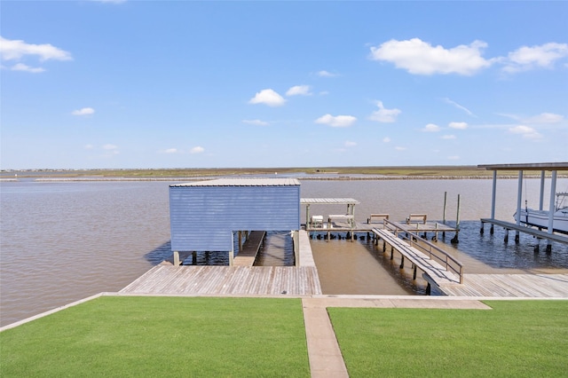 view of dock with a water view and a lawn