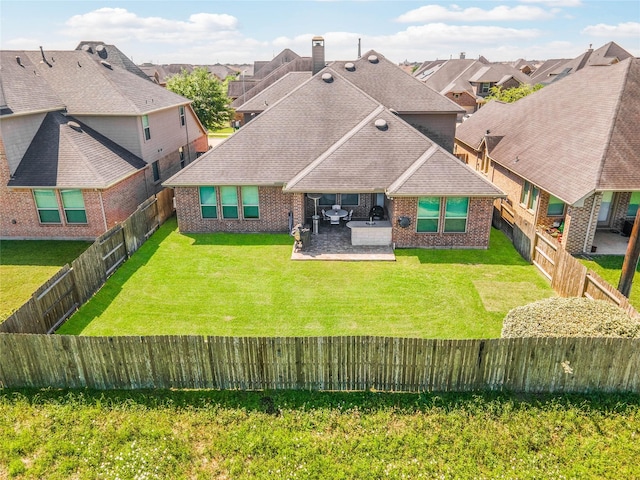 19810 Quarry Stone Ln, Richmond, TX 77407 - rear view of house featuring a residential view, brick siding, a fenced backyard, and a yard