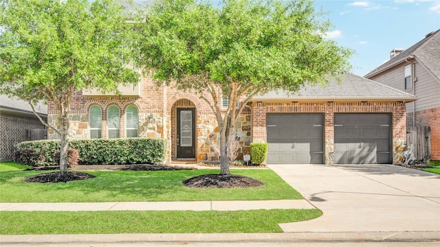 19810 Quarry Stone Ln, Richmond, TX 77407 - view of front facade with a garage, concrete driveway, a front lawn, and brick siding
