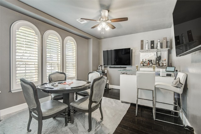 19810 Quarry Stone Ln, Richmond, TX 77407 - dining area featuring baseboards, visible vents, dark wood-style flooring, and a ceiling fan