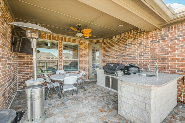 19810 Quarry Stone Ln, Richmond, TX 77407 - view of patio with area for grilling, ceiling fan, a sink, and outdoor dining area