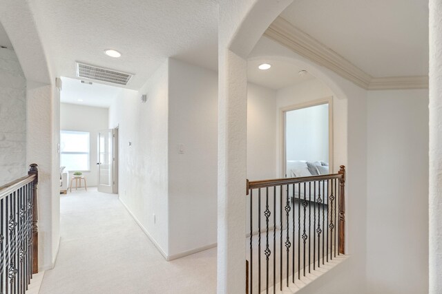 corridor featuring visible vents, recessed lighting, carpet, and an upstairs landing