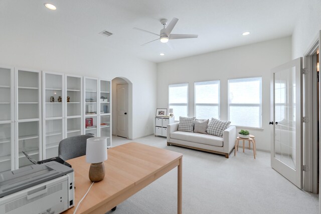 home office with light colored carpet, arched walkways, a ceiling fan, recessed lighting, and visible vents