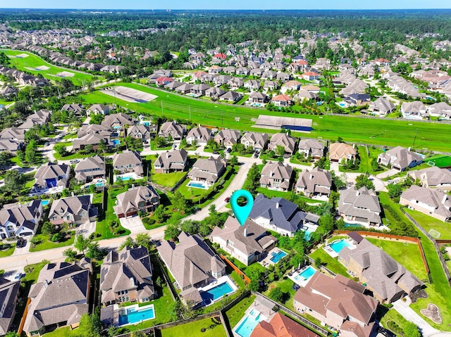 birds eye view of property with a residential view