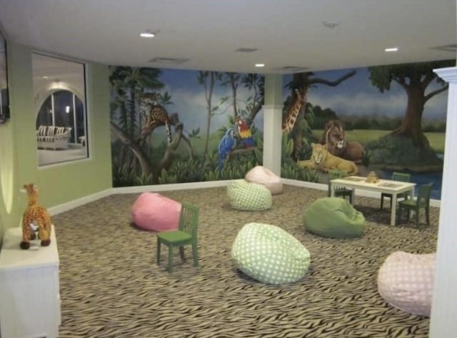 recreation room featuring carpet flooring and baseboards