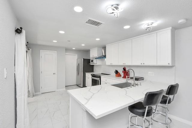 6430 Grandvale Dr, Houston, TX 77072 - kitchen featuring appliances with stainless steel finishes, a sink, visible vents, and recessed lighting