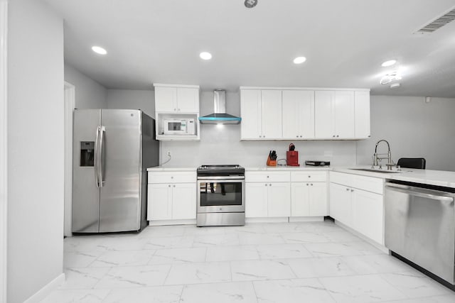 6430 Grandvale Dr, Houston, TX 77072 - kitchen with wall chimney range hood, marble finish floor, a sink, and appliances with stainless steel finishes