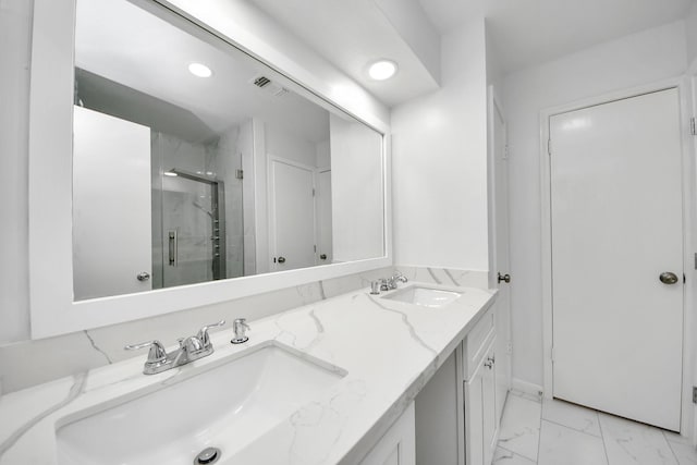6430 Grandvale Dr, Houston, TX 77072 - bathroom with marble finish floor, double vanity, a marble finish shower, and a sink
