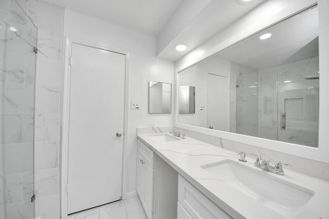 6430 Grandvale Dr, Houston, TX 77072 - full bathroom featuring marble finish floor, a sink, recessed lighting, and a marble finish shower