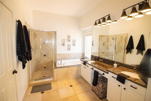 full bath with a bath, a stall shower, double vanity, and tile patterned flooring