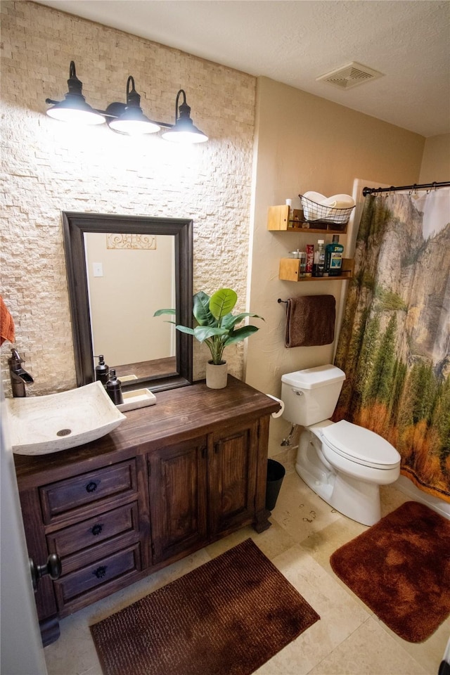 bathroom with vanity, toilet, and a shower with curtain