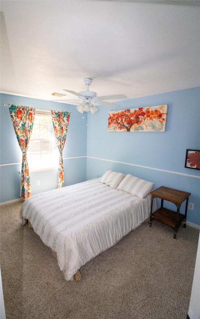 bedroom with carpet flooring, ceiling fan, and baseboards
