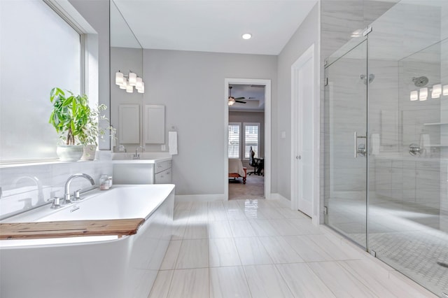 ensuite bathroom featuring a shower stall, vanity, and connected bathroom